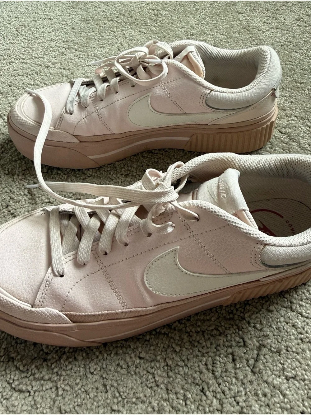 Nike Women’s Light Pink Low-Top Sneakers with White Swoosh